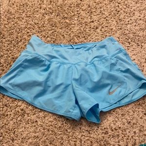 Light blue nike running shorts